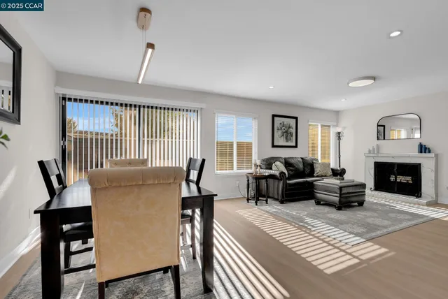 a bedroom with furniture and a fireplace