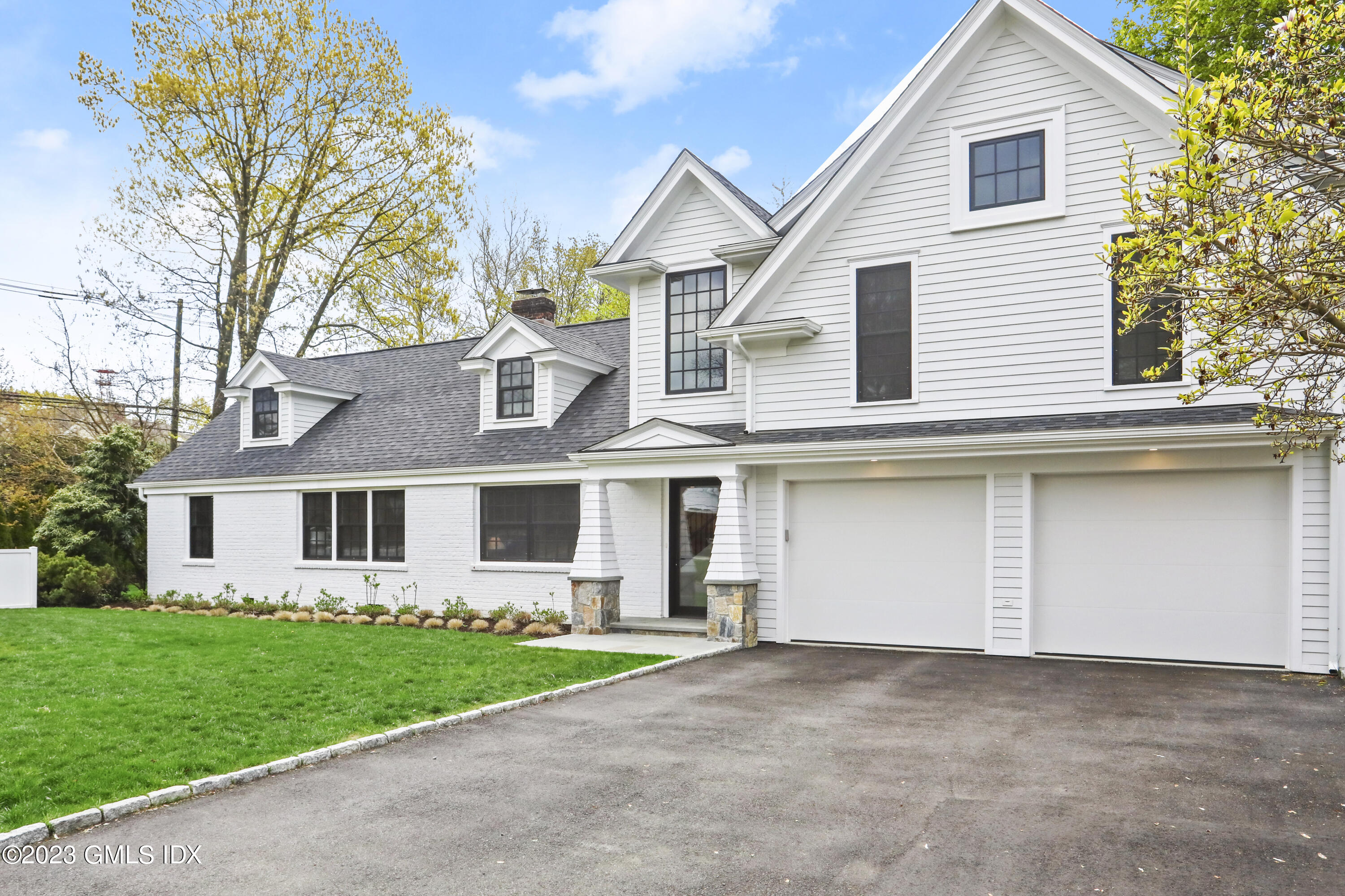 2 Northridge Road Old Greenwich, CT 06870 - Photo 1 of 43 front view of the house and a yard
