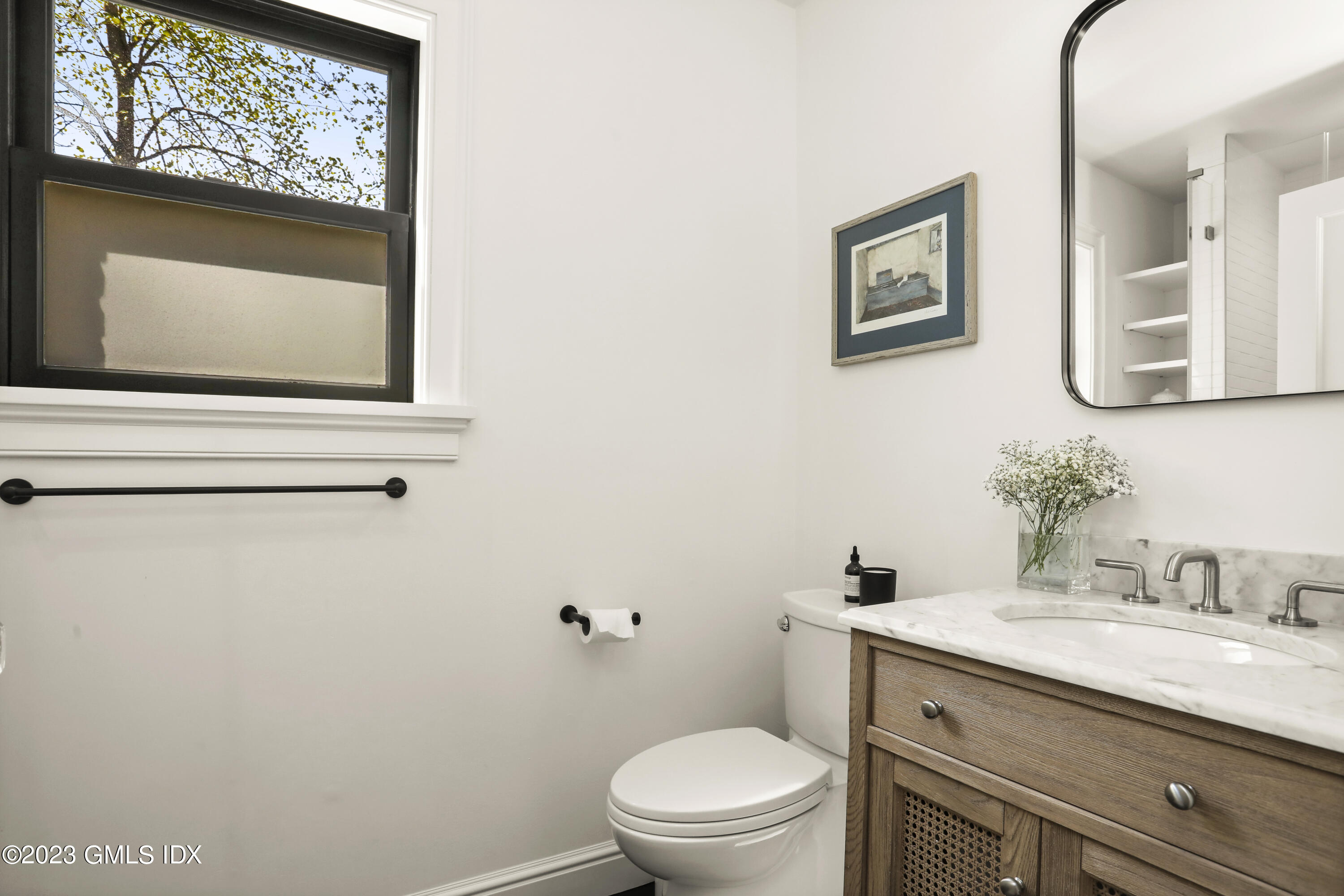 2 Northridge Road Old Greenwich, CT 06870 - Photo 15 of 43 a bathroom with a granite countertop toilet a sink and mirror