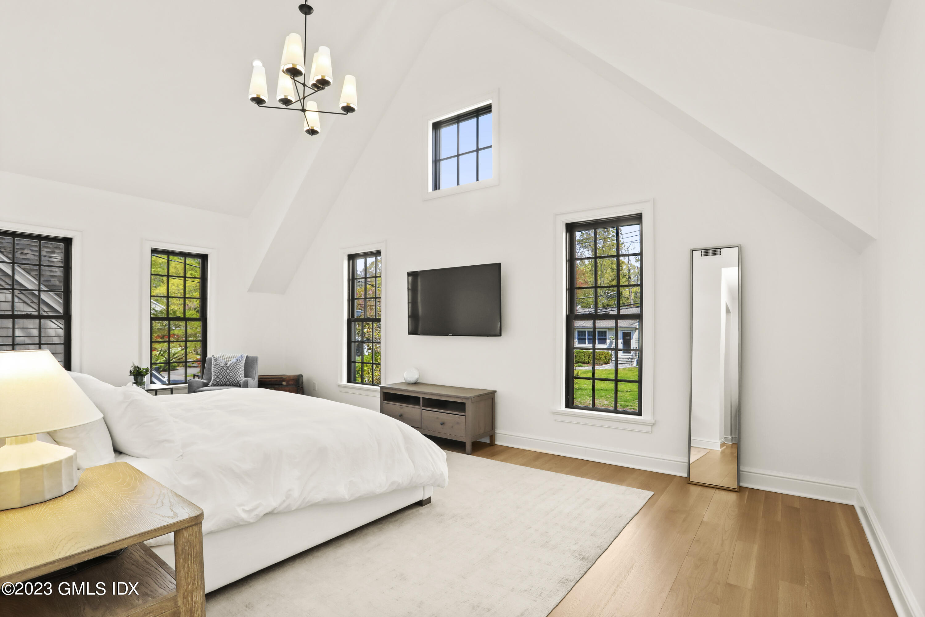 2 Northridge Road Old Greenwich, CT 06870 - Photo 18 of 43 a bedroom with a bed and a flat screen tv