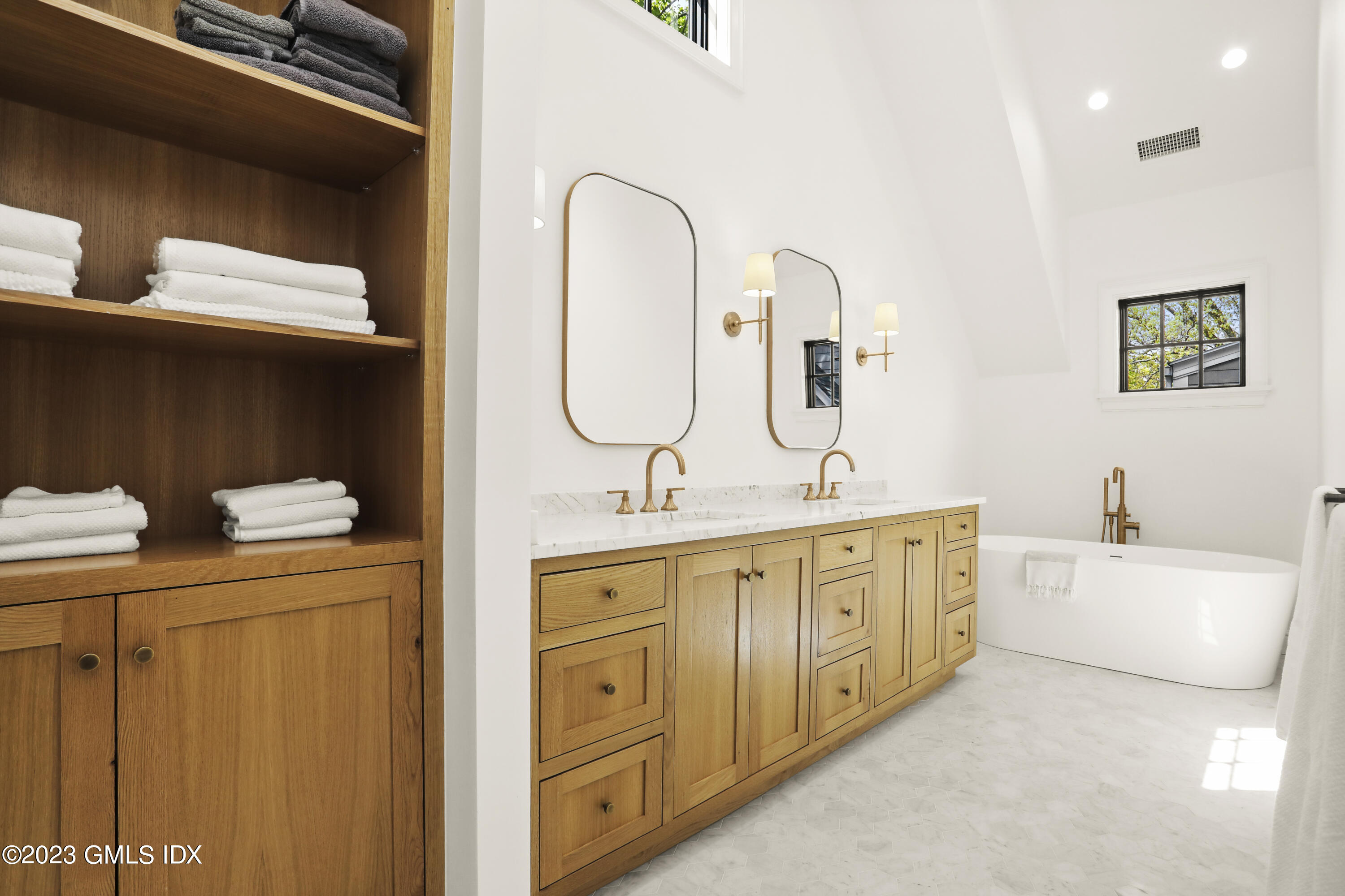 2 Northridge Road Old Greenwich, CT 06870 - Photo 21 of 43 a spacious bathroom with a double vanity sink and mirror