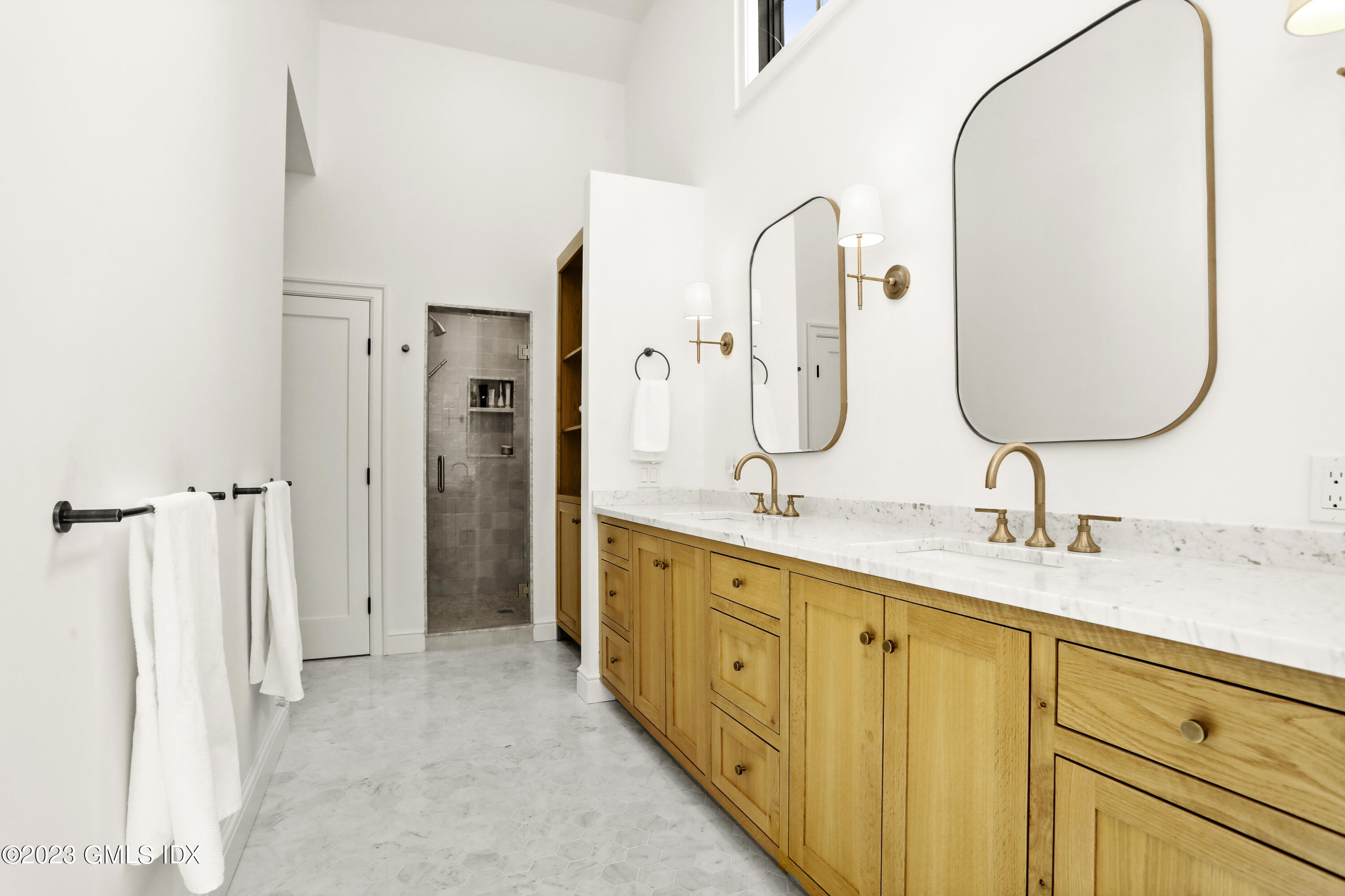 2 Northridge Road Old Greenwich, CT 06870 - Photo 22 of 43 a spacious bathroom with a double vanity sink and a mirror