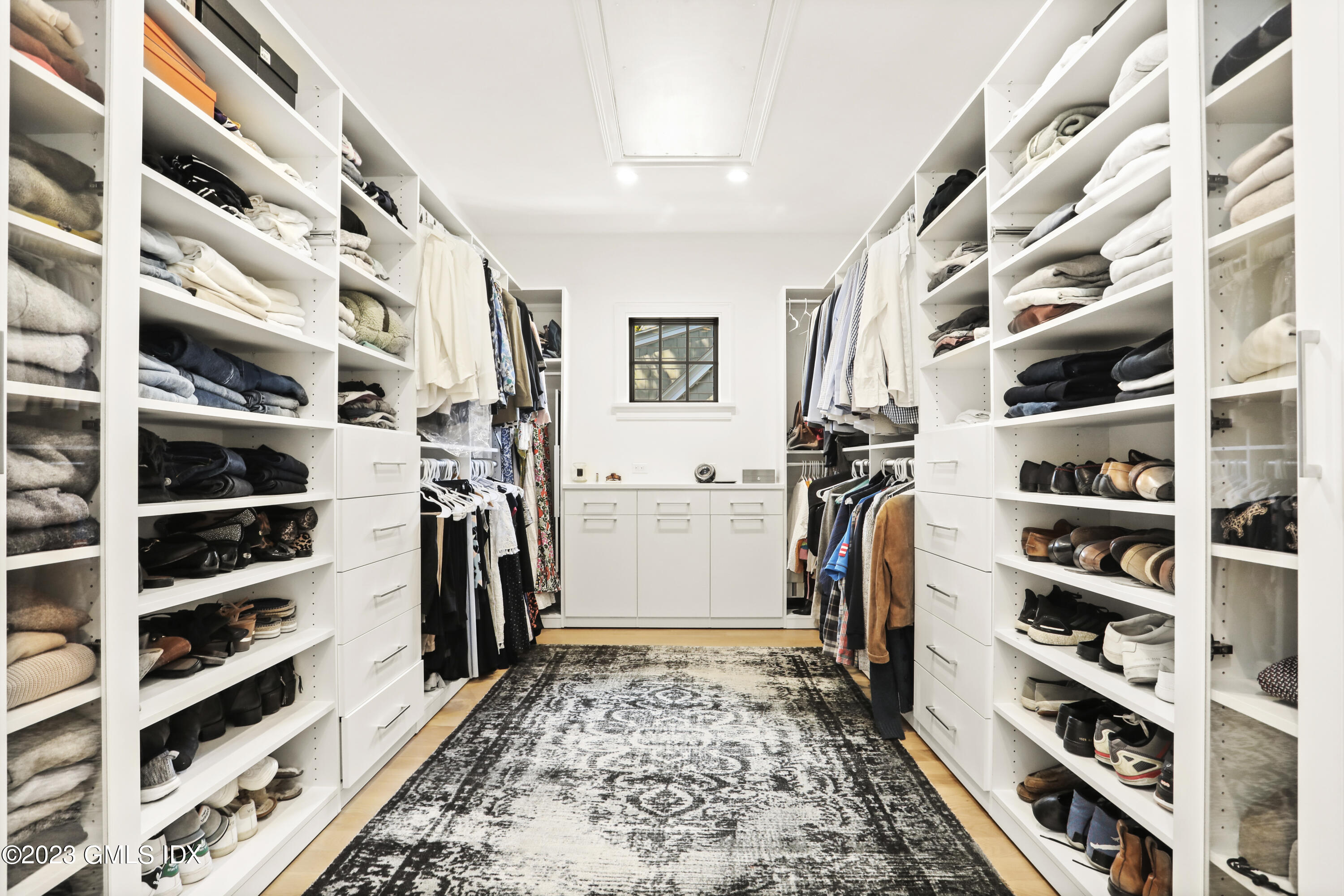 2 Northridge Road Old Greenwich, CT 06870 - Photo 24 of 43 a view of walk in closet with clothes and shoes