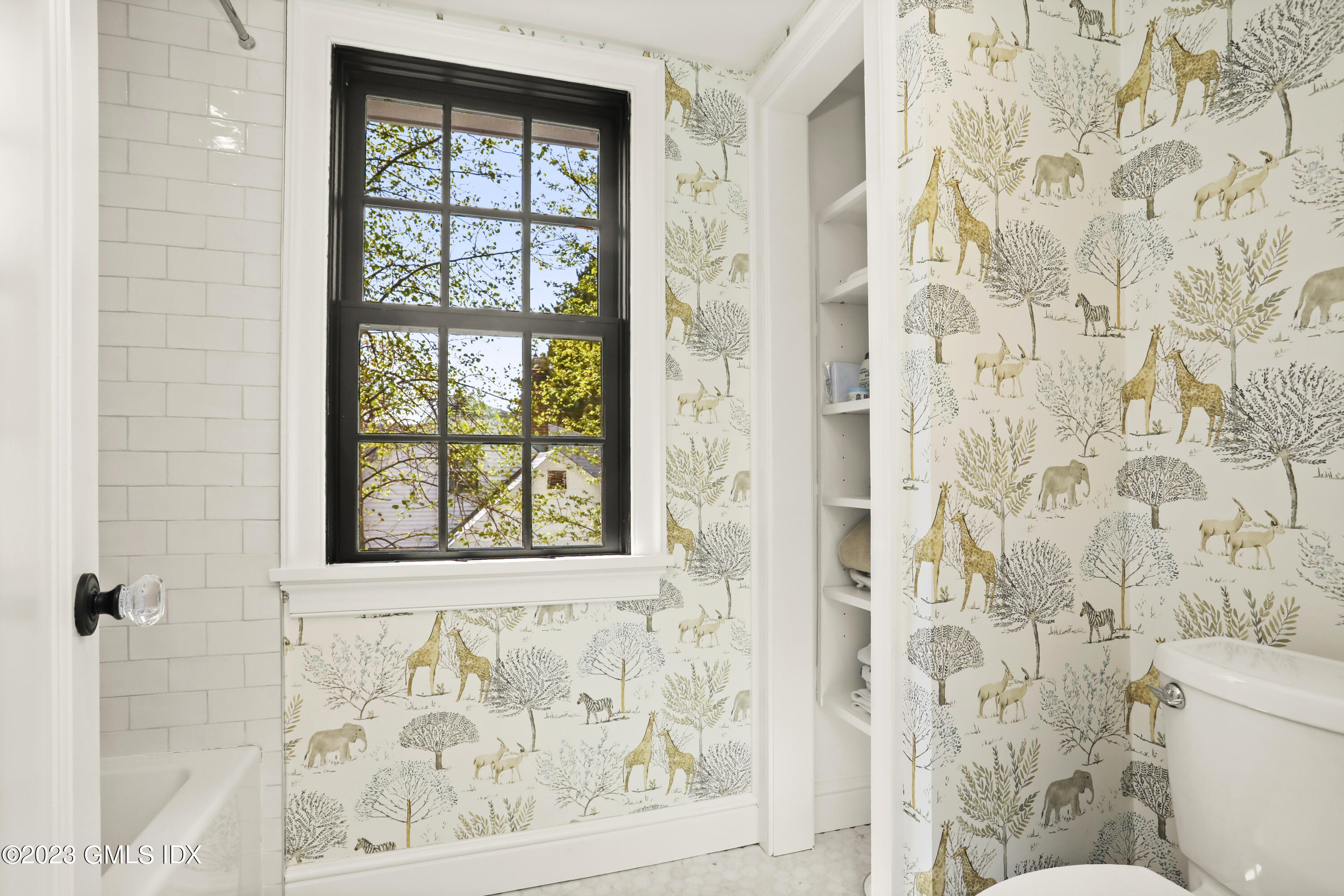 2 Northridge Road Old Greenwich, CT 06870 - Photo 27 of 43 a bathroom with a window and a shower curtain