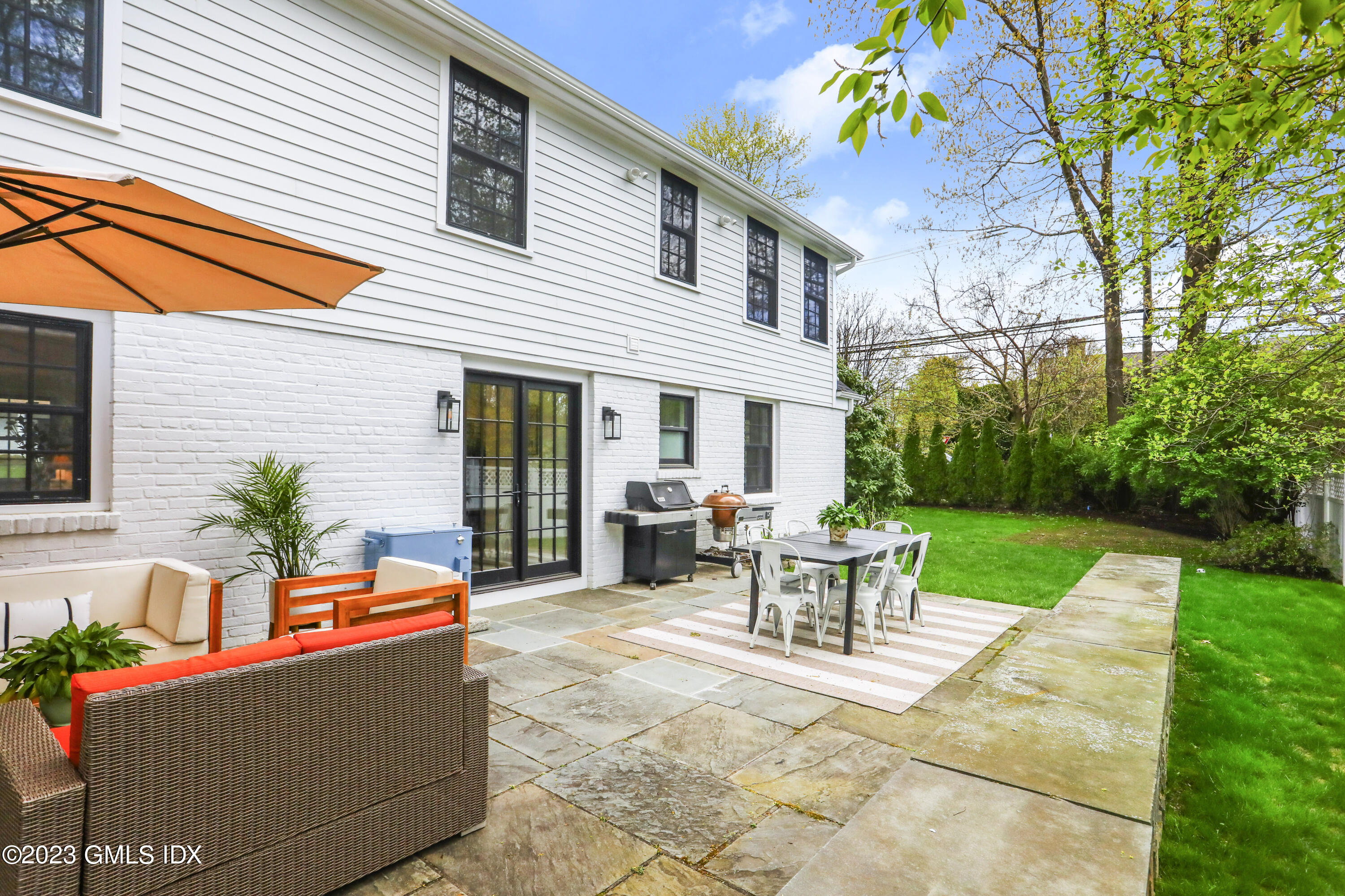 2 Northridge Road Old Greenwich, CT 06870 - Photo 32 of 43 a view of a house with backyard and sitting area