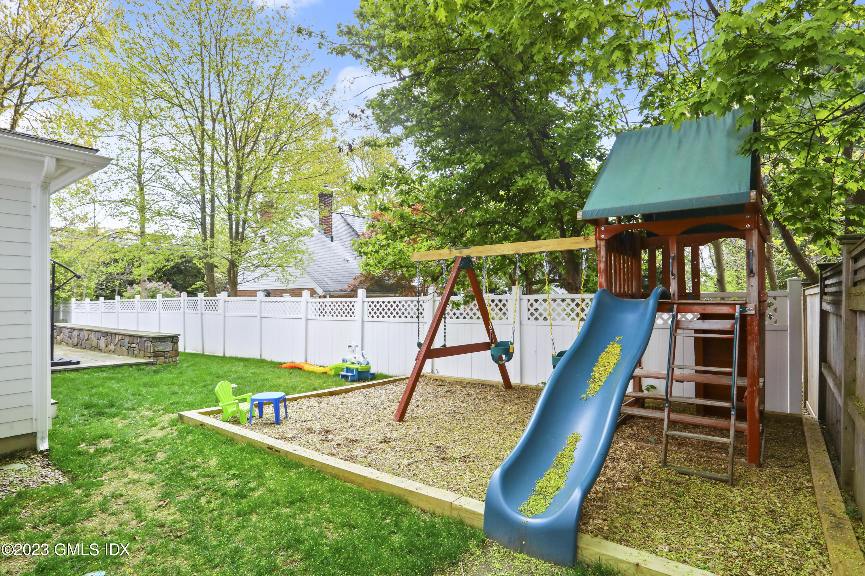 2 Northridge Road Old Greenwich, CT 06870 - Photo 39 of 43 a view of a backyard with a slide