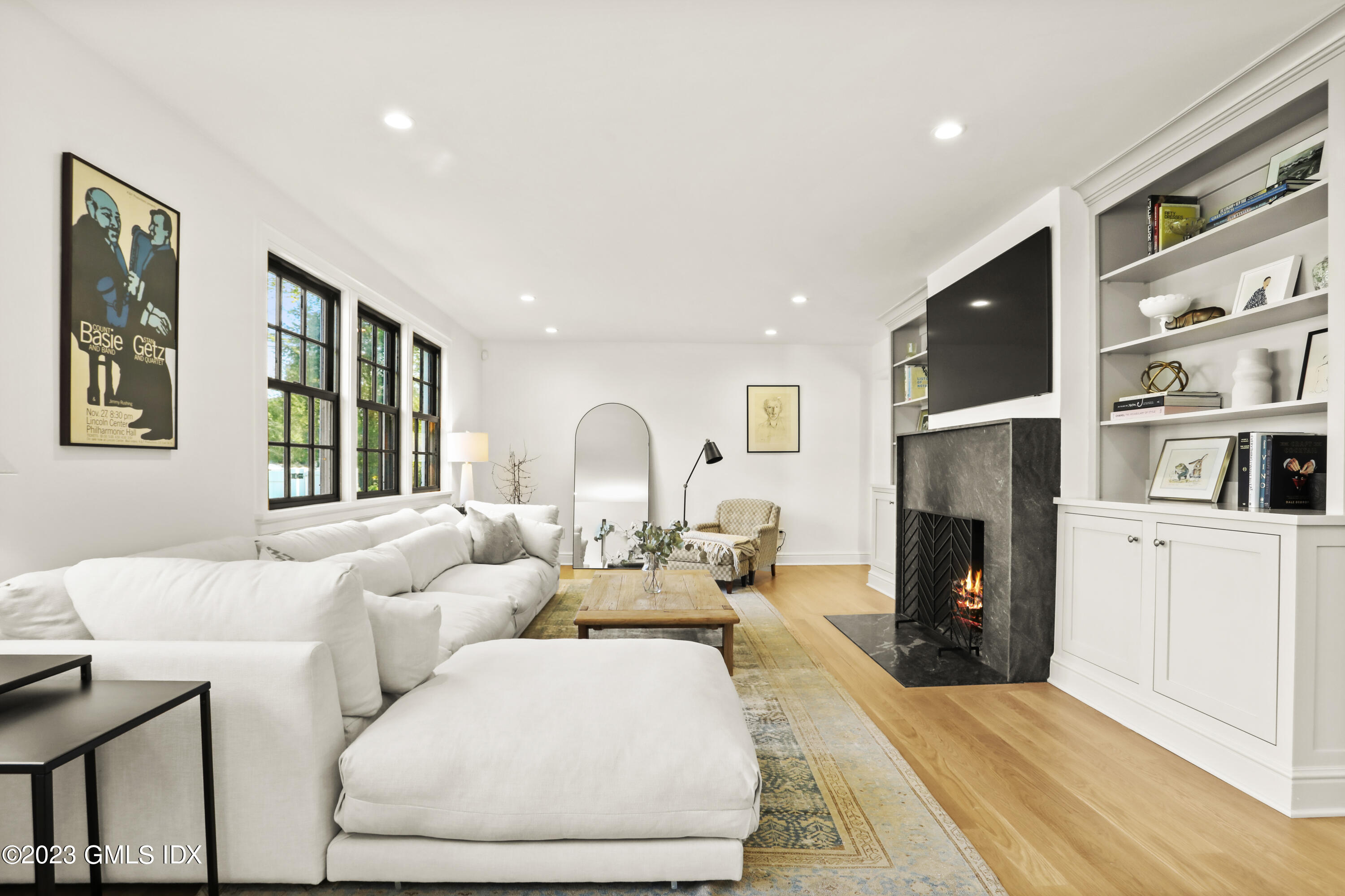 2 Northridge Road Old Greenwich, CT 06870 - Photo 4 of 43 a living room with furniture fireplace and flat screen tv
