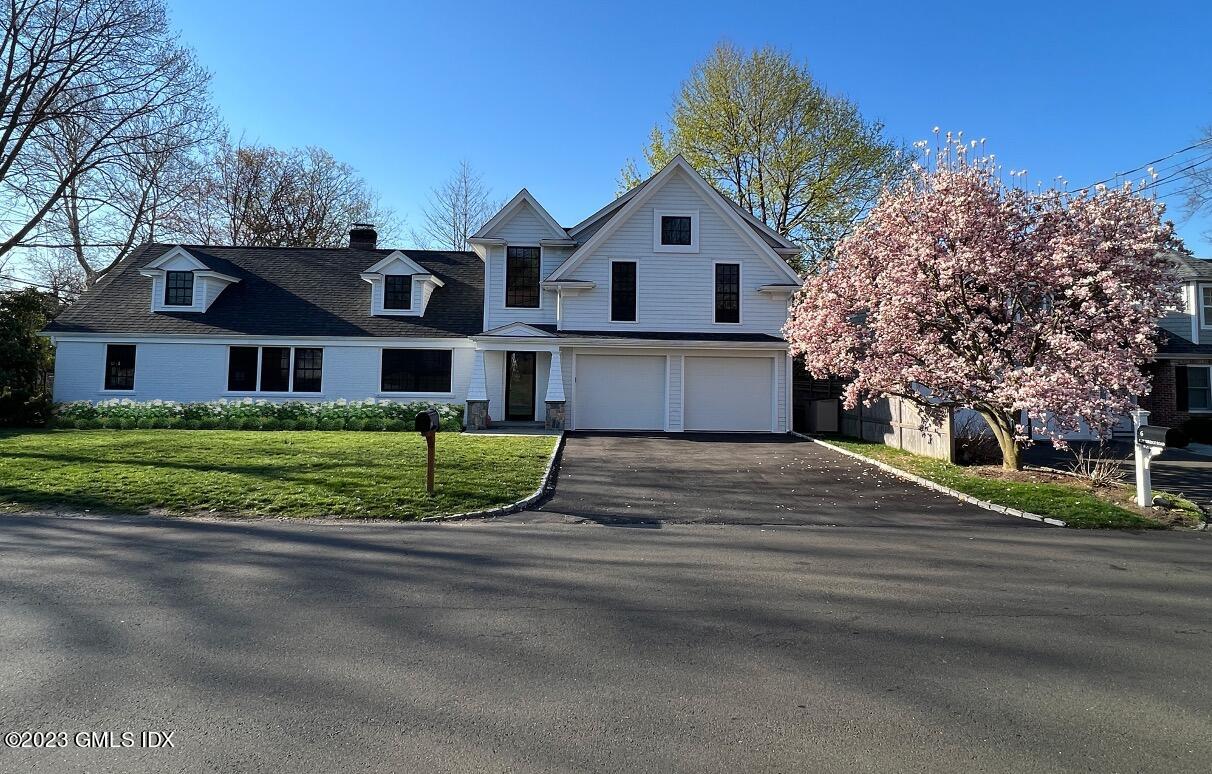 2 Northridge Road Old Greenwich, CT 06870 - Photo 42 of 43 a front view of a house with a yard