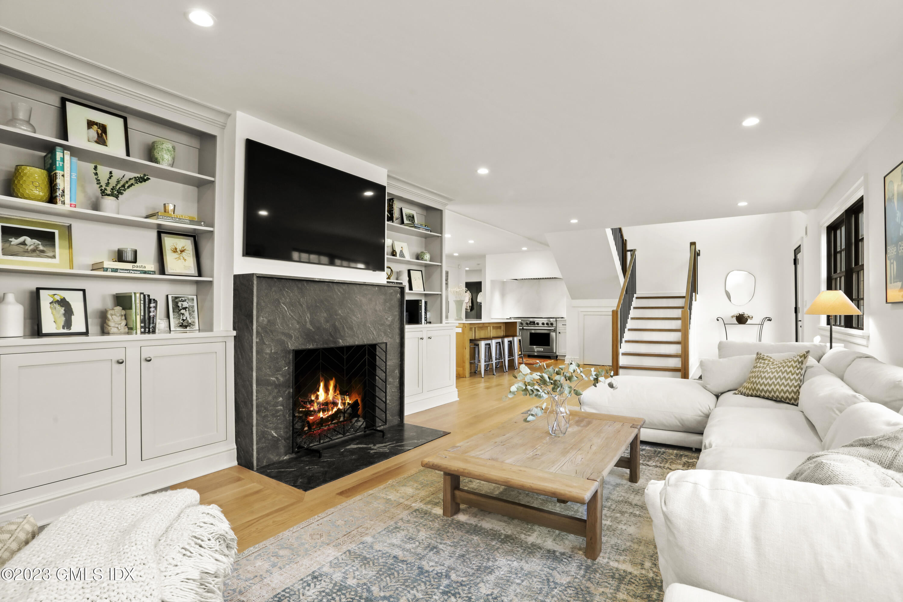2 Northridge Road Old Greenwich, CT 06870 - Photo 6 of 43 a living room with furniture fireplace and flat screen tv