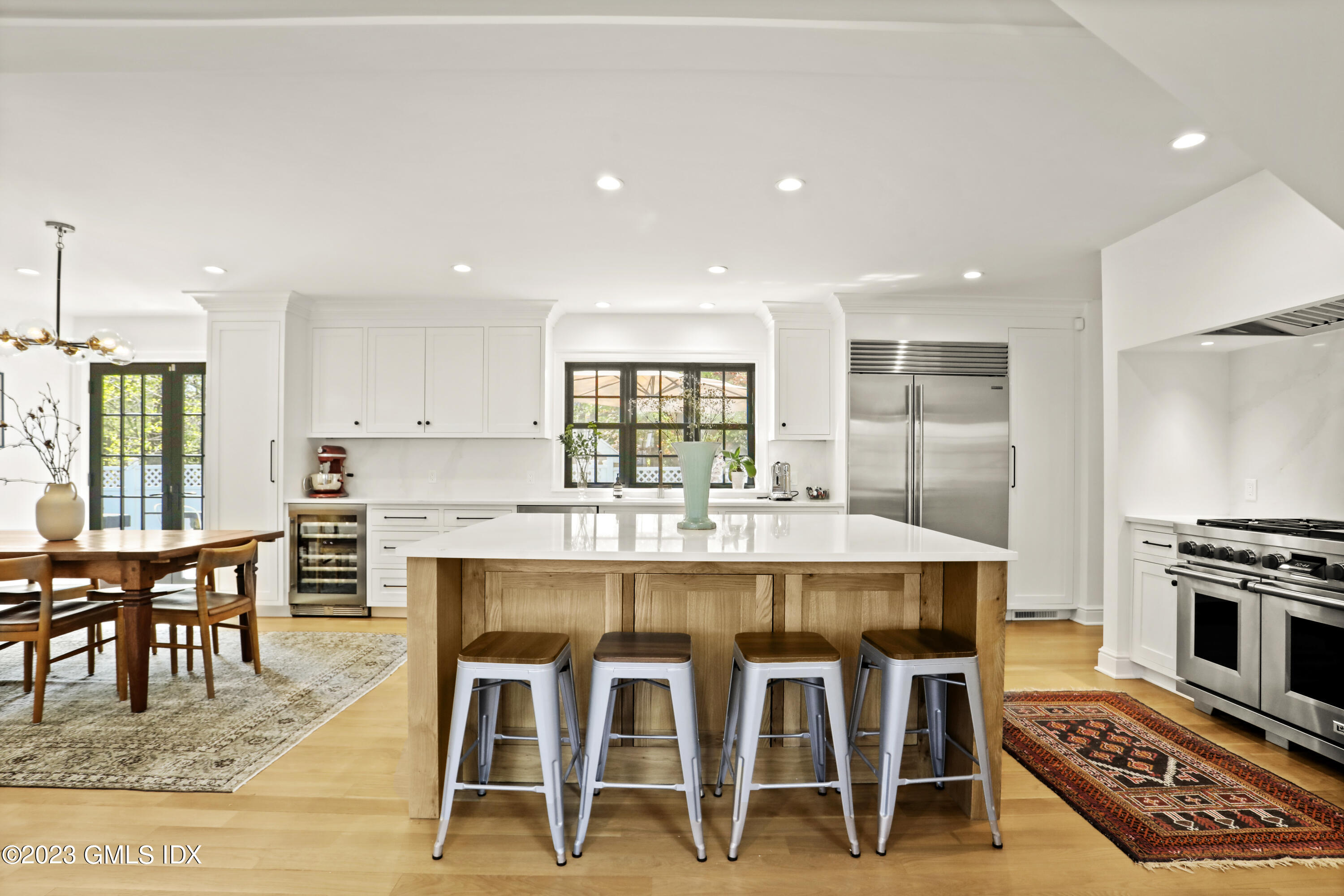 2 Northridge Road Old Greenwich, CT 06870 - Photo 8 of 43 a large kitchen with a table and chairs in it