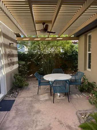 a table and chairs in a patio