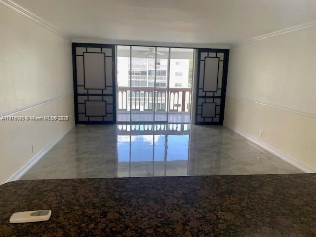 a view of an empty room and window