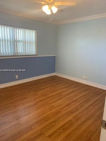 an empty room with wooden floor