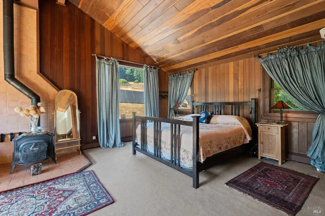 a bathroom with a granite countertop sink mirror toilet and bathtub
