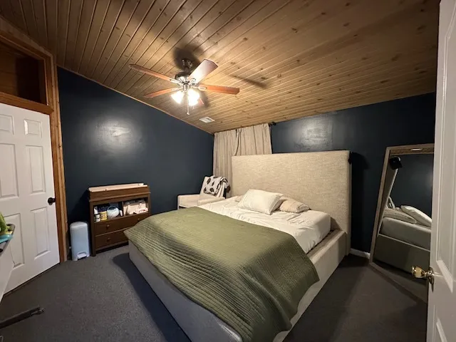 a bedroom with a bed and a television