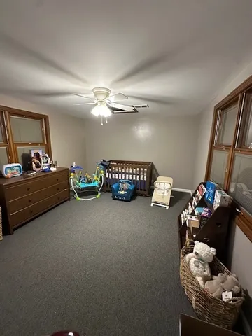 a bed room with furniture and a chandelier
