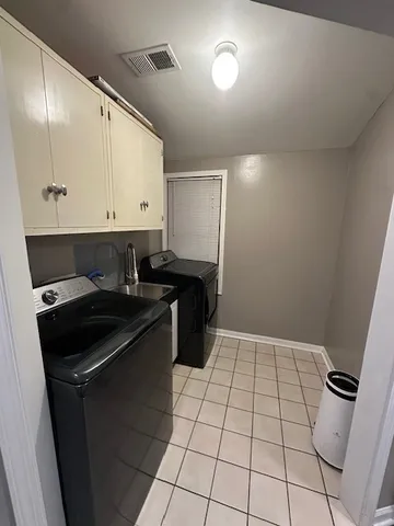 a kitchen with a sink and a stove top oven