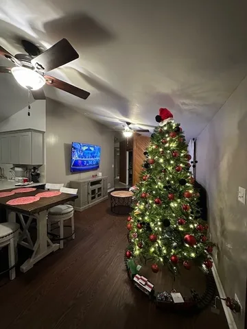 a room with lots of flowers and a table