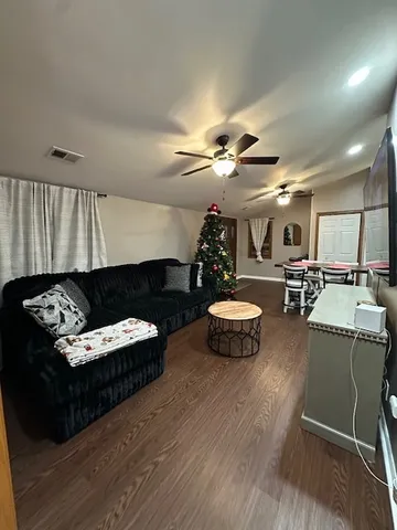 a living room with furniture and a table