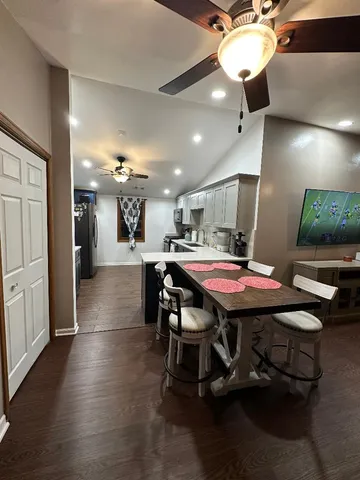a dining room with a table chairs and a dining table