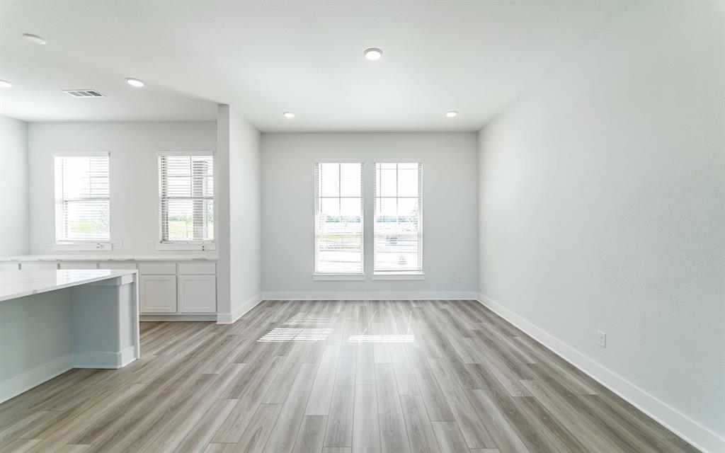 2012 Casting Ridge Mesquite, TX 75181 - Photo 13 of 28 wooden floor in an empty room with a window