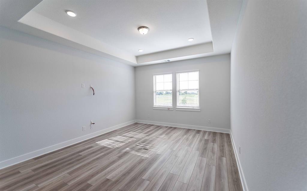 2012 Casting Ridge Mesquite, TX 75181 - Photo 14 of 28 wooden floor in an empty room with a window