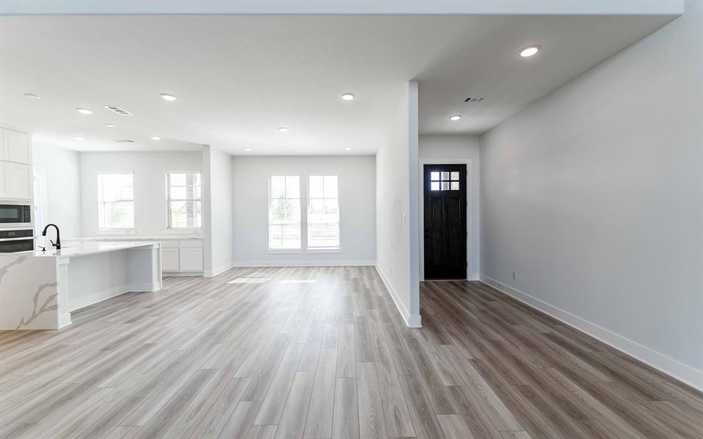 2012 Casting Ridge Mesquite, TX 75181 - Photo 2 of 28 an empty room with wooden floor and windows