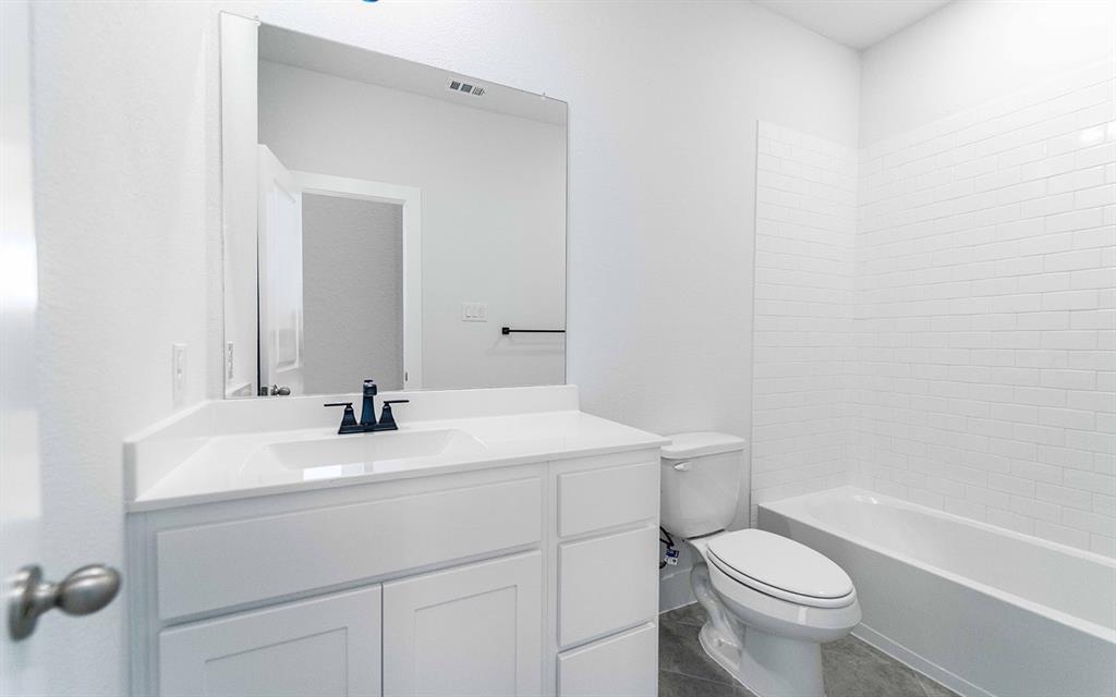 2012 Casting Ridge Mesquite, TX 75181 - Photo 22 of 28 a bathroom with a sink a toilet and a bathtub