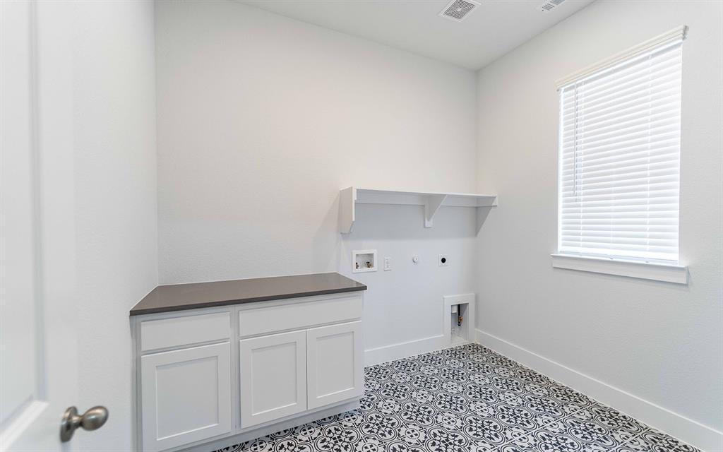2012 Casting Ridge Mesquite, TX 75181 - Photo 27 of 28 a kitchen with a white cabinets and a stove