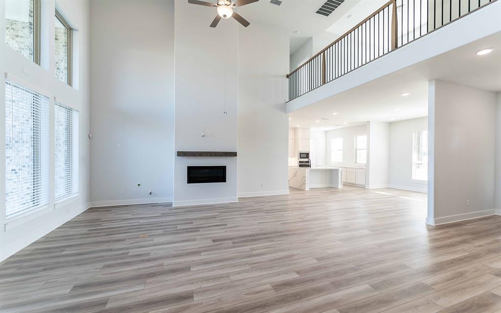 2012 Casting Ridge Mesquite, TX 75181 - Photo 4 of 28 a view of an empty room with wooden floor and a window