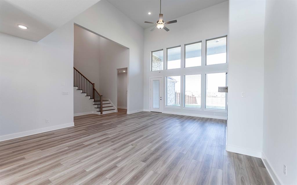 2012 Casting Ridge Mesquite, TX 75181 - Photo 6 of 28 a view of an empty room with wooden floor and a window