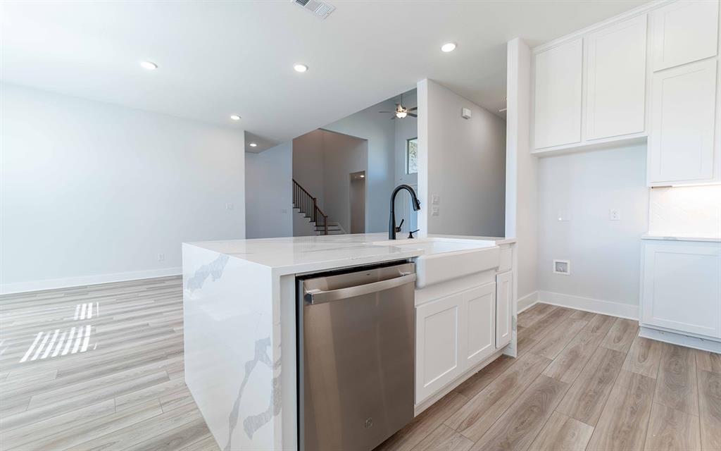 2012 Casting Ridge Mesquite, TX 75181 - Photo 10 of 28 a kitchen with a sink cabinets and wooden floor