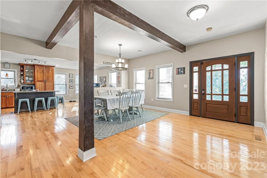 13801 East Rocky River Road Davidson, NC 28036 - Photo 12 of 42 a view of a livingroom with furniture and hardwood floor