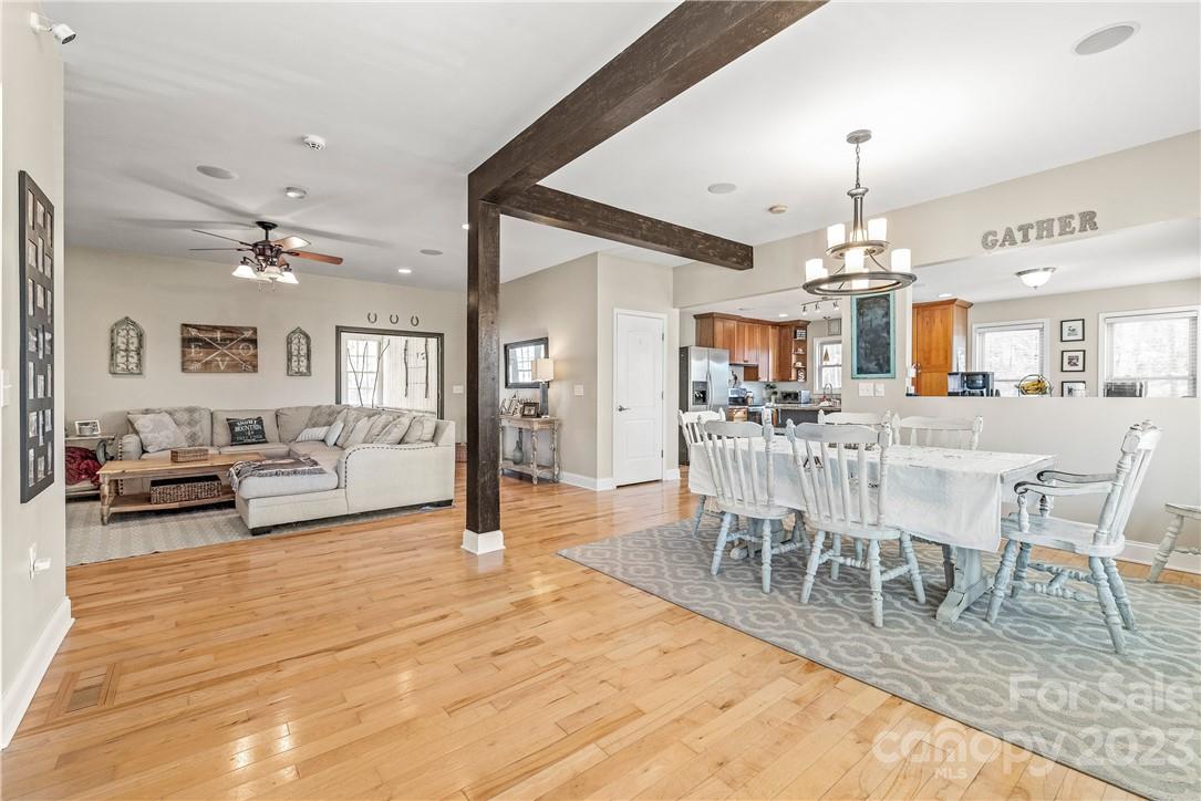 13801 East Rocky River Road Davidson, NC 28036 - Photo 13 of 42 a view of a dining room with furniture and chandelier