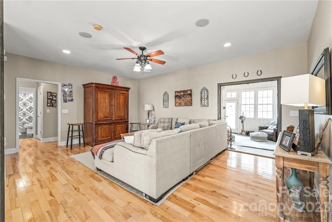 13801 East Rocky River Road Davidson, NC 28036 - Photo 15 of 42 a living room with furniture and a flat screen tv