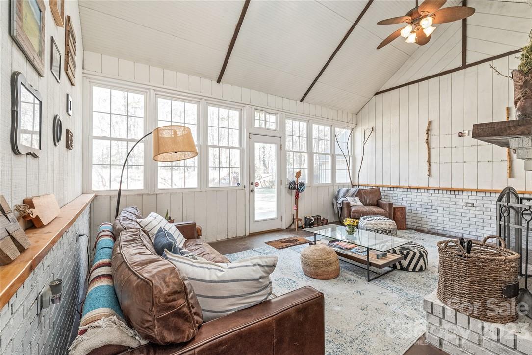 13801 East Rocky River Road Davidson, NC 28036 - Photo 17 of 42 a living room with furniture and a large window