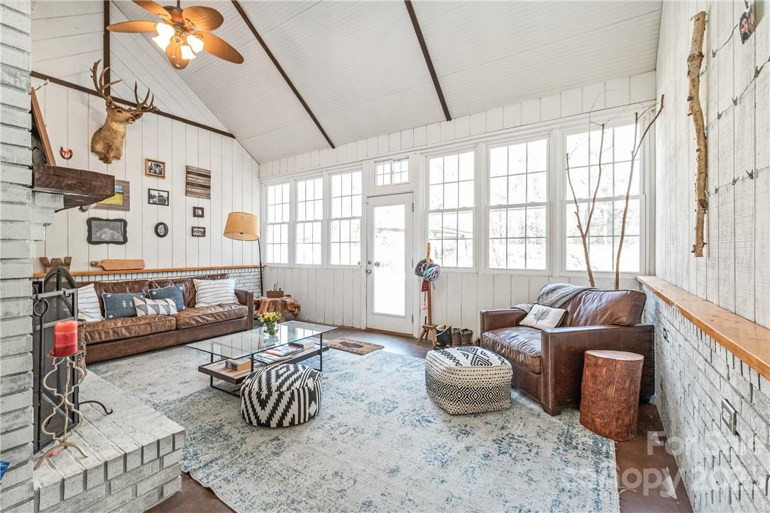 13801 East Rocky River Road Davidson, NC 28036 - Photo 18 of 42 a living room with furniture and a large window