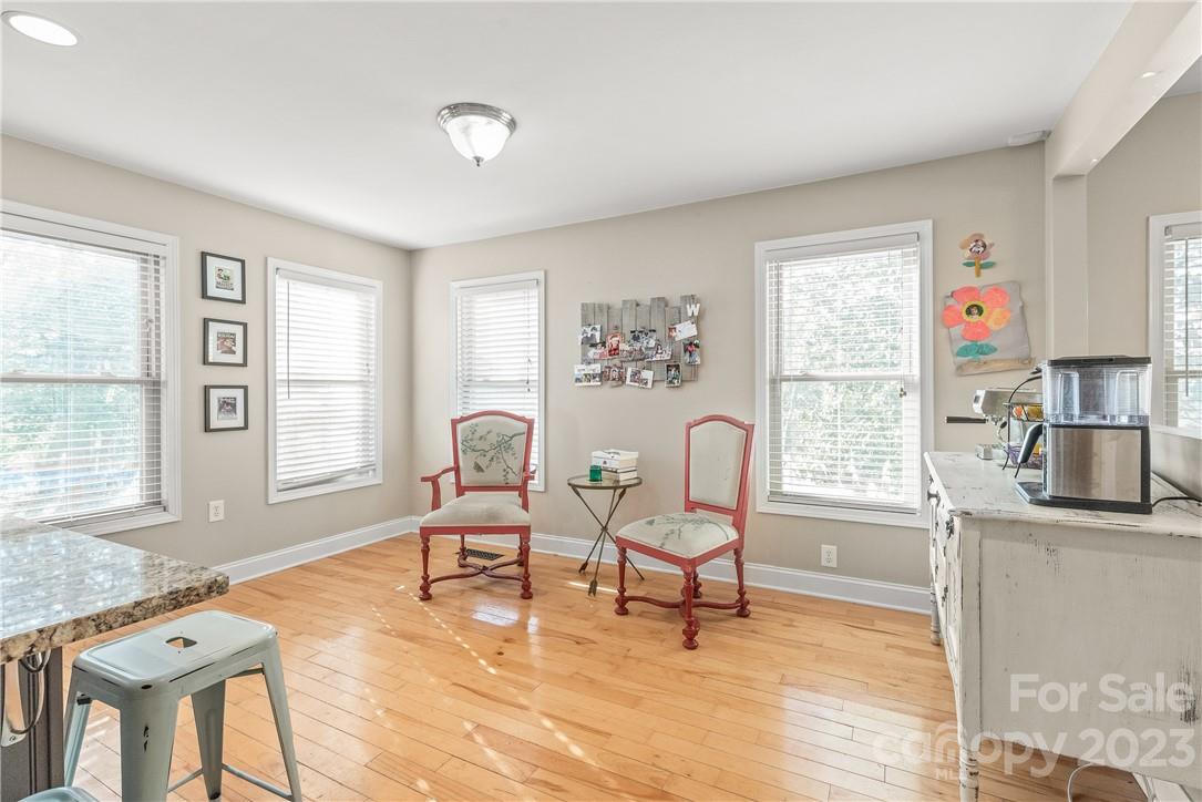 13801 East Rocky River Road Davidson, NC 28036 - Photo 23 of 42 a living room with fireplace furniture and a window