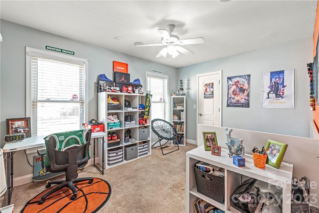 13801 East Rocky River Road Davidson, NC 28036 - Photo 25 of 42 a view of a workspace with furniture and a window