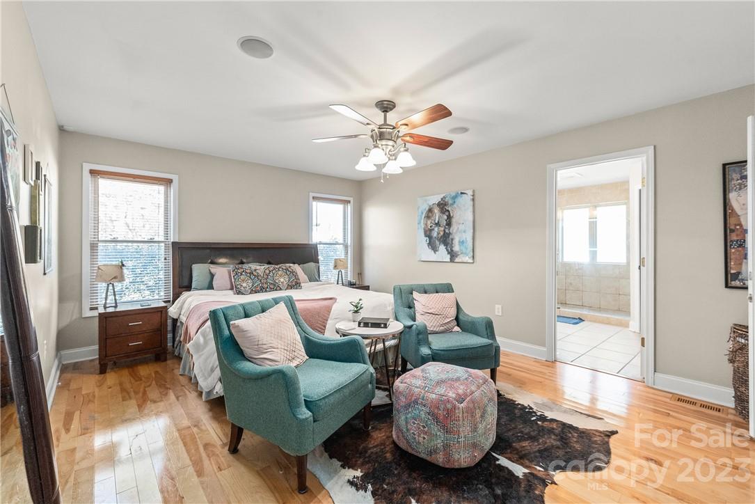 13801 East Rocky River Road Davidson, NC 28036 - Photo 29 of 42 a living room with furniture and a large window