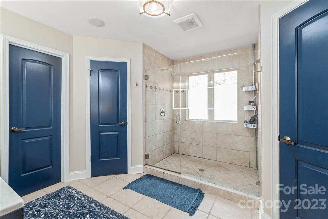 13801 East Rocky River Road Davidson, NC 28036 - Photo 31 of 42 a bathroom with a shower