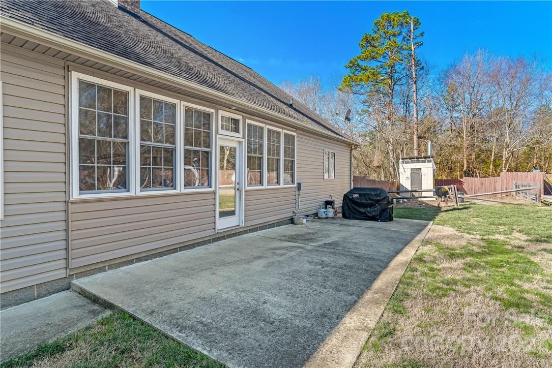 13801 East Rocky River Road Davidson, NC 28036 - Photo 39 of 42 a front view of a house with a yard