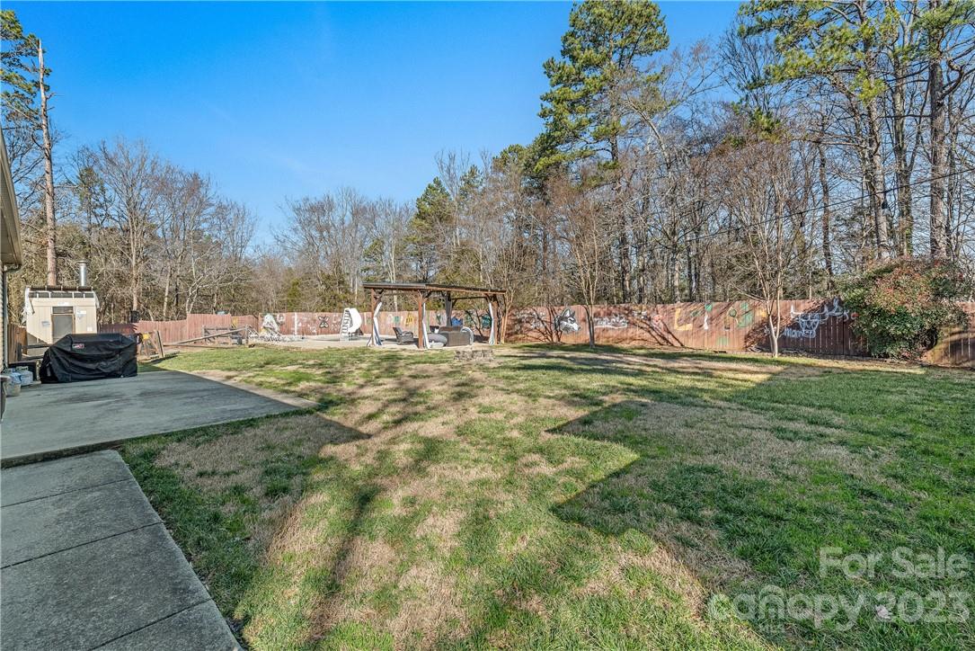 13801 East Rocky River Road Davidson, NC 28036 - Photo 40 of 42 a view of a house with a yard