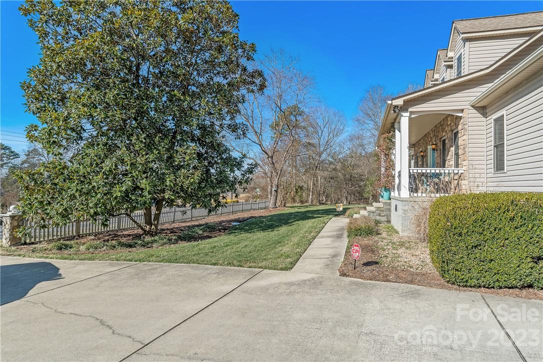 13801 East Rocky River Road Davidson, NC 28036 - Photo 7 of 42 front view of a house with a yard