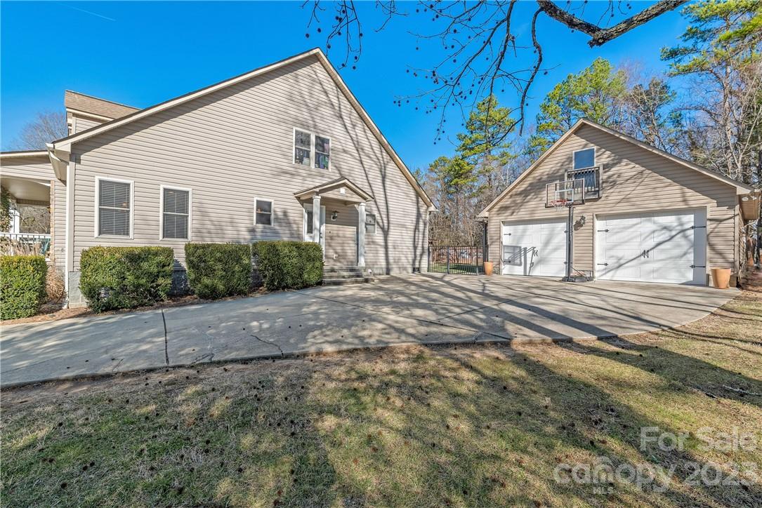 13801 East Rocky River Road Davidson, NC 28036 - Photo 8 of 42 a view of a house with a yard