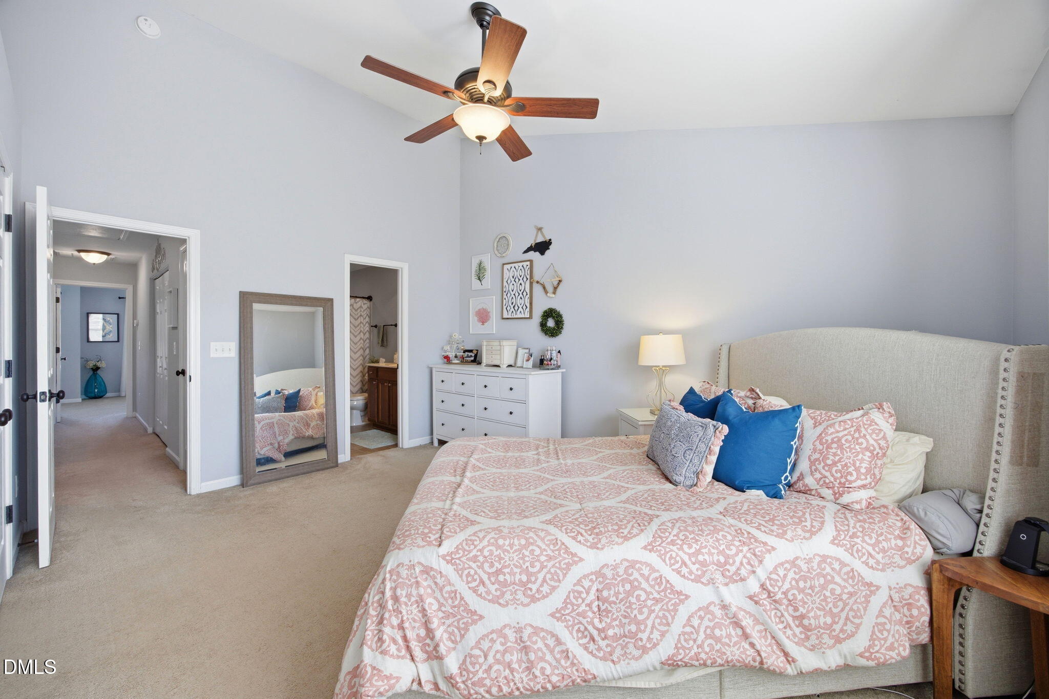 2827 Corbett Grove Drive Raleigh, NC 27616 - Photo 21 of 49 a bedroom with a bed and a chandelier