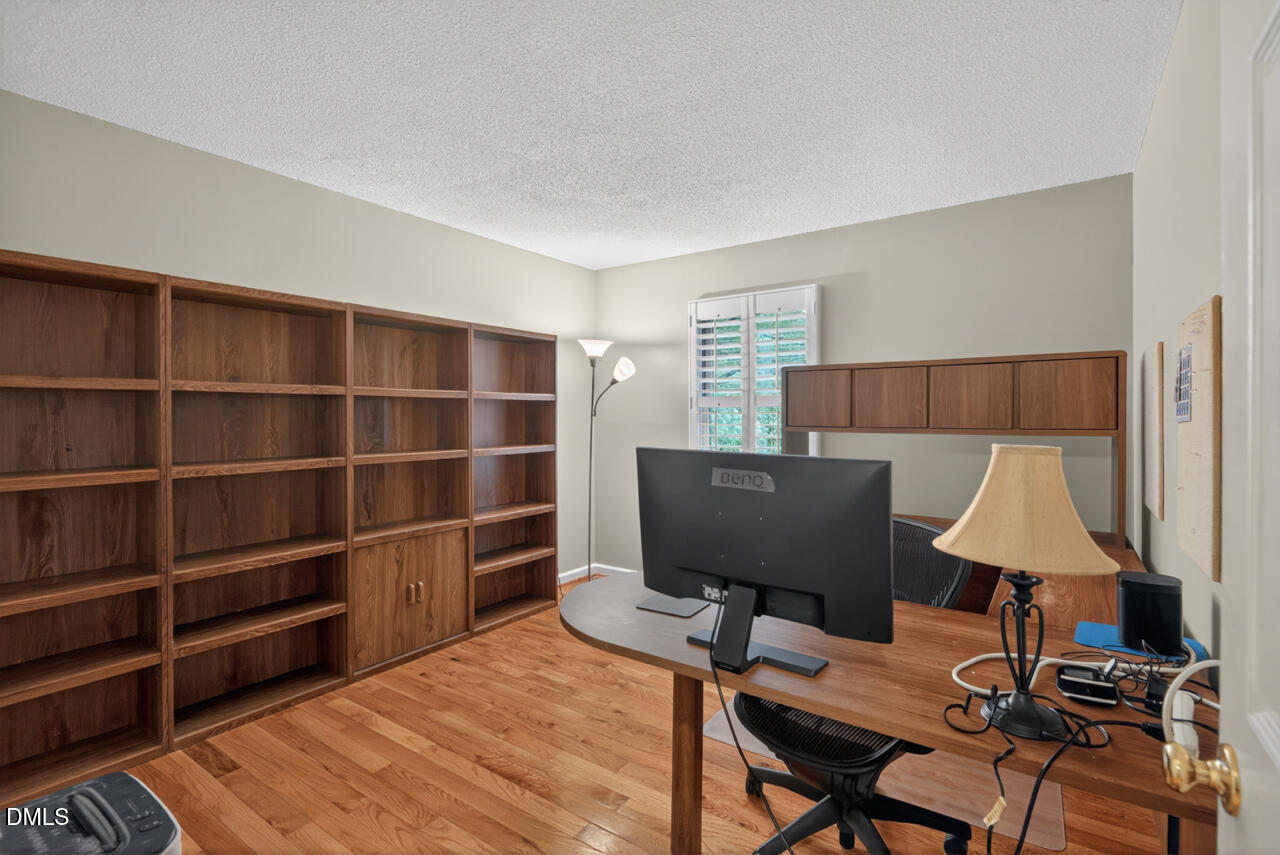 3307 Coachman's Way Durham, NC 27705 - Photo 33 of 50 a view of a workspace with furniture and a lamp