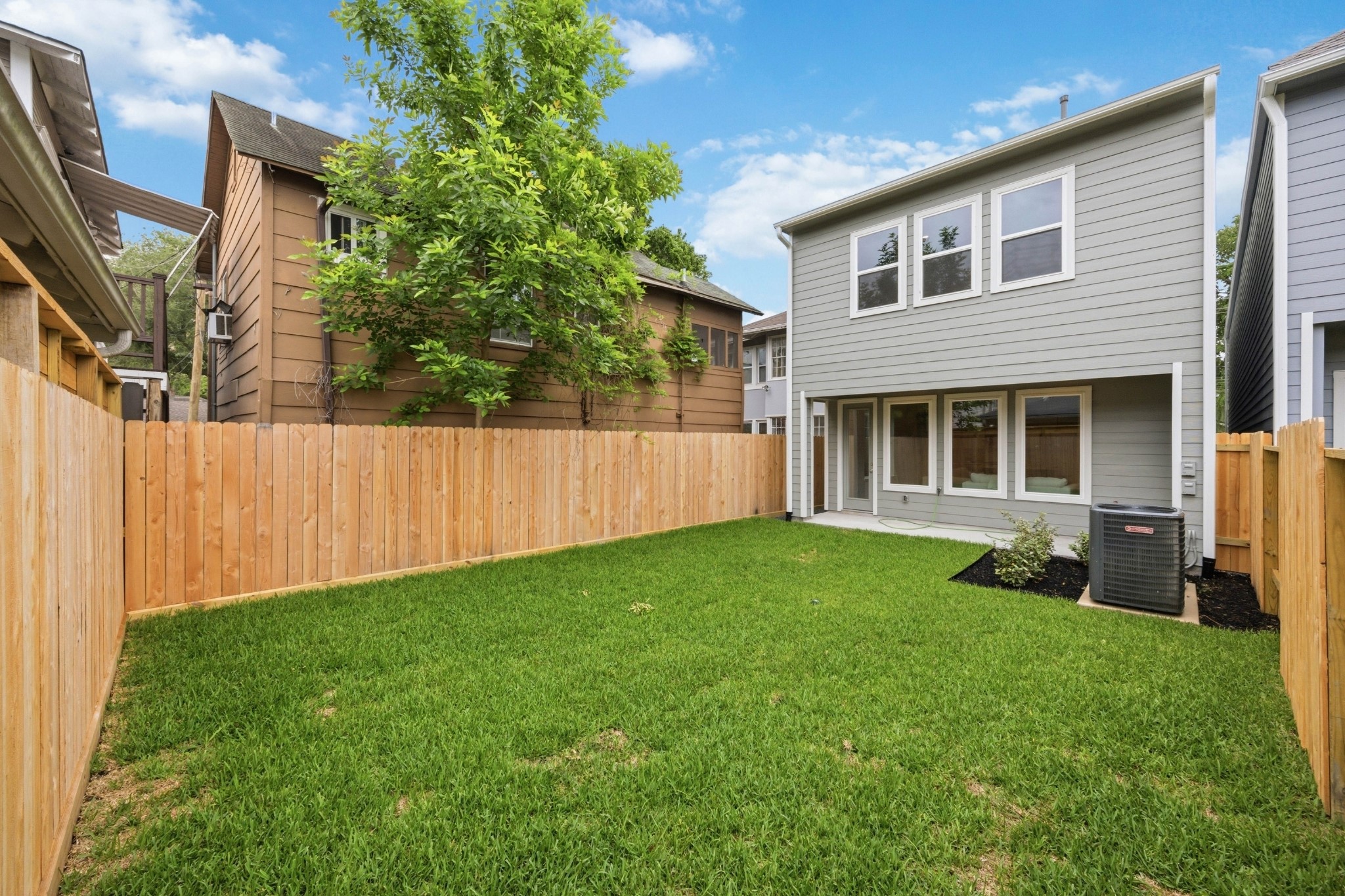 4317 Roseland Street, Unit B Houston, TX 77006 - Photo 10 of 29 Step outside to your wide, covered porch, overlooking a generously sized, fully sodded yard, enclosed by a cedar privacy fence for moments of peaceful solitude.