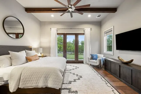 a spacious bathroom with a granite countertop tub sink and mirror