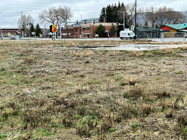 a view of car parked on the side of road